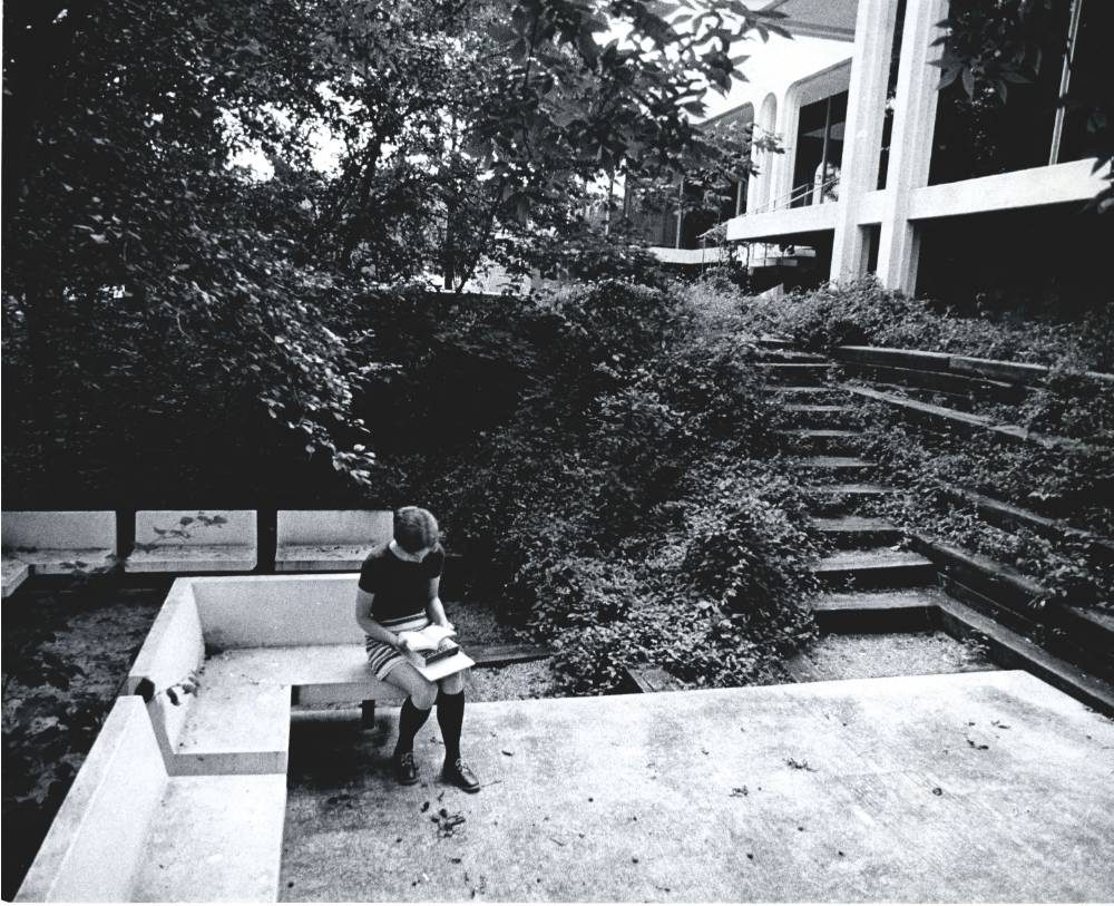 Student using the Seidman House outdoor study area. The area fell into disrepair and was removed, ca. 1972.